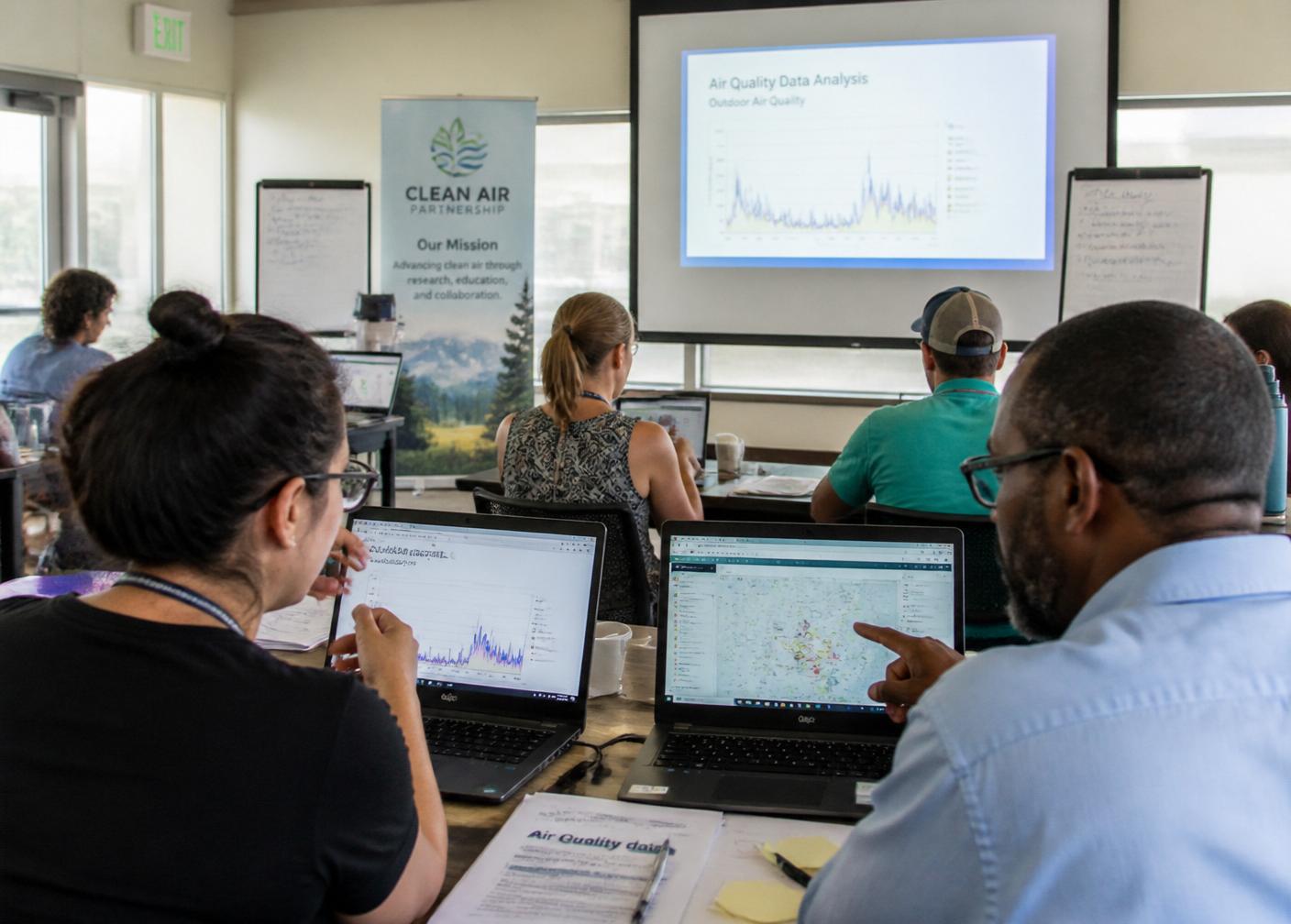 Participants reviewing air-quality data during an AREC training workshop